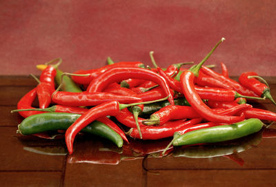 Close-up of chili peppers on cutting board