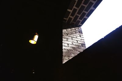 Low angle view of illuminated building against sky at night