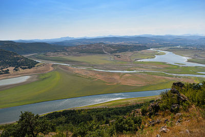 High angle view of the river amidst landscape against sky