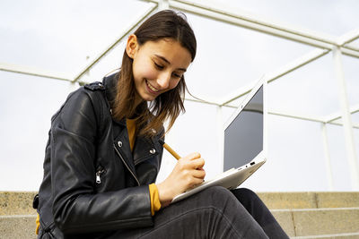 Female student studying with her laptop.