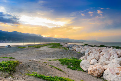 Scenic view of road against sky during sunset