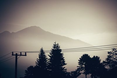 Silhouette of mountain against sky at sunset