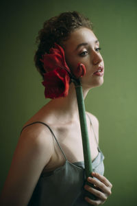 Portrait of young woman looking at camera