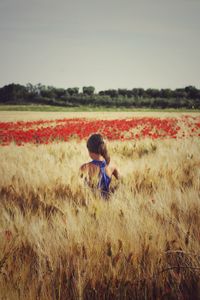 Full length of woman on field against sky