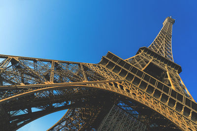 Low angle view of bridge against blue sky