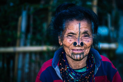 Portrait of smiling senior woman outdoors