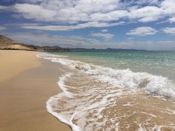 Scenic view of beach against sky