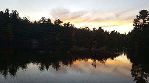 Scenic view of lake at sunset