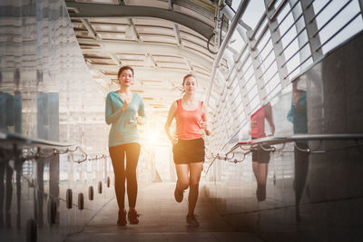 Women walking in corridor of building