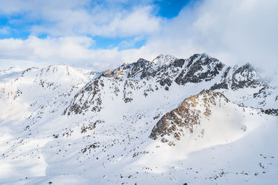 Mountain landscape with snow capped rocky pyrenees mountains in andorra