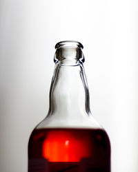 Close-up of bottle against white background
