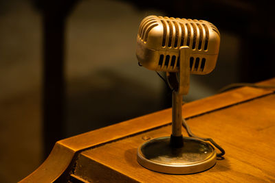 Close-up of telephone booth on table