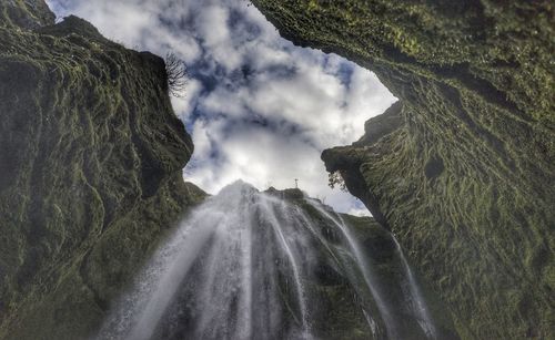 Panoramic view of waterfall against sky