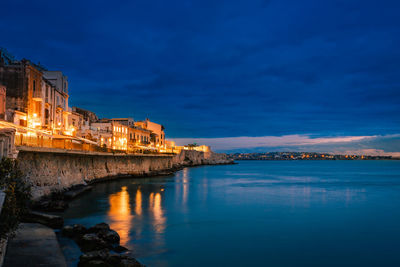 Long exposure of ortigia at sunset on the sea