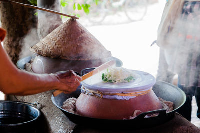 Close-up of man preparing food