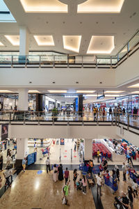 High angle view of people walking in corridor