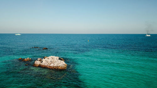 Scenic view of sea against clear sky