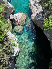 High angle view of rocks in sea