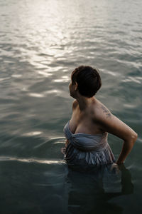 Pregnant  woman standing in lake