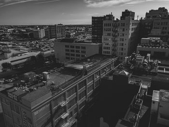 High angle view of buildings in city against sky