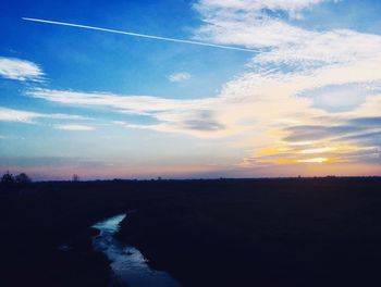 Scenic view of silhouette landscape against sky during sunset