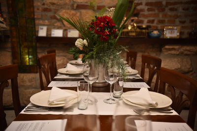 Flower vase on table in restaurant