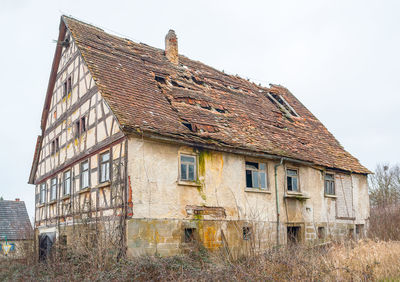 Low angle view of old building against clear sky