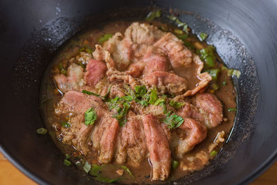 High angle view of meat in cooking pan