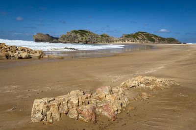 Scenic view of beach against sky