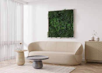Stabilized moss hanging on the wall in modern interior. panel of green moss. 