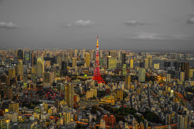 Aerial view of city lit up at night