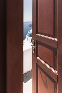 Open wooden door in santorini, greece, cyclades