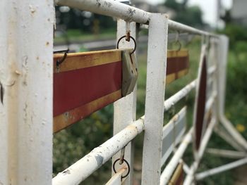 Close-up of padlock on railing