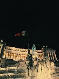 Low angle view of statue against clear sky at night