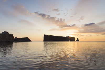 View of the famous percé cliffs and rock during a beautiful summer pastel coloured sunrise