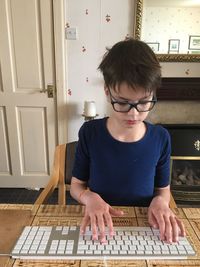 Full length of boy playing on table