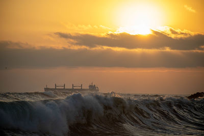 Scenic view of sea against sky during sunset