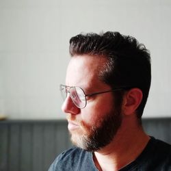 Close-up portrait of young man looking away