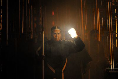 Man standing in illuminated room