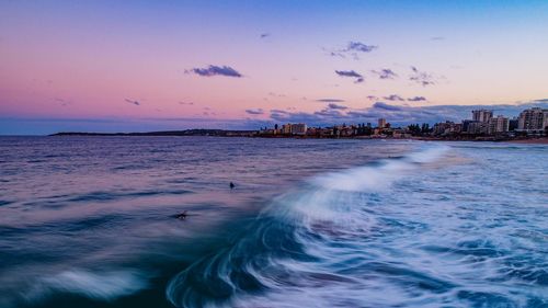 Scenic view of sea against sky at sunset