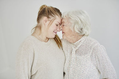 Grandmother with granddaughter, studio shot