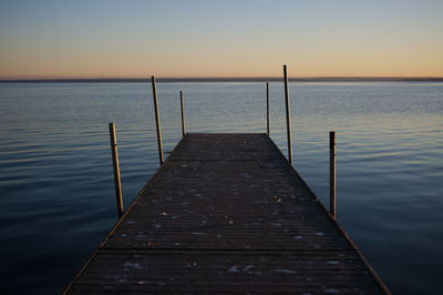 Jetty leading to calm sea