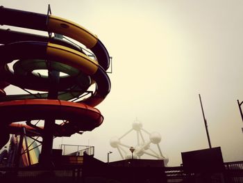 Low angle view of carousel against clear sky