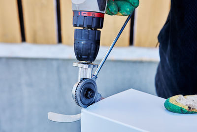 Midsection of man working on table