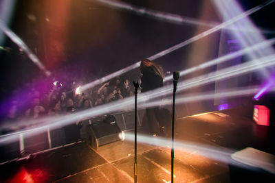 Crowd looking at performer during concert