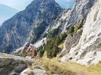 Scenic view of rocks and mountains against sky