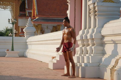 Shirtless man at temple