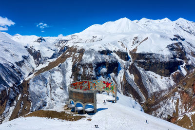 Snow covered mountains against sky