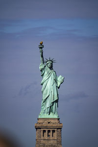 Low angle view of statue against sky