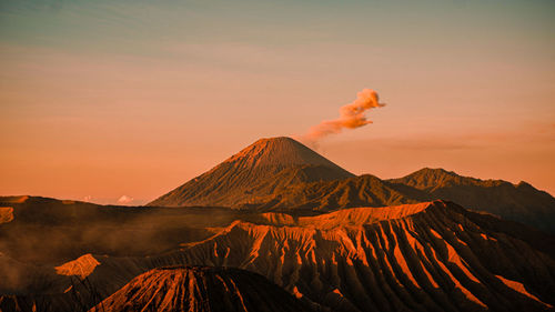 Scenic view of mountains against sky during sunset